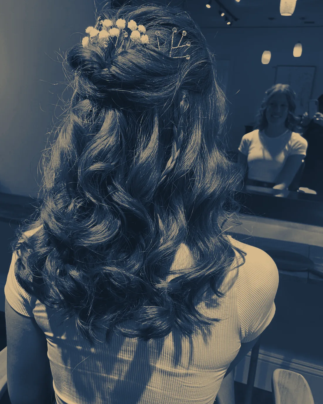 Prom hair styling rendered in the studio's blue and champagne tones