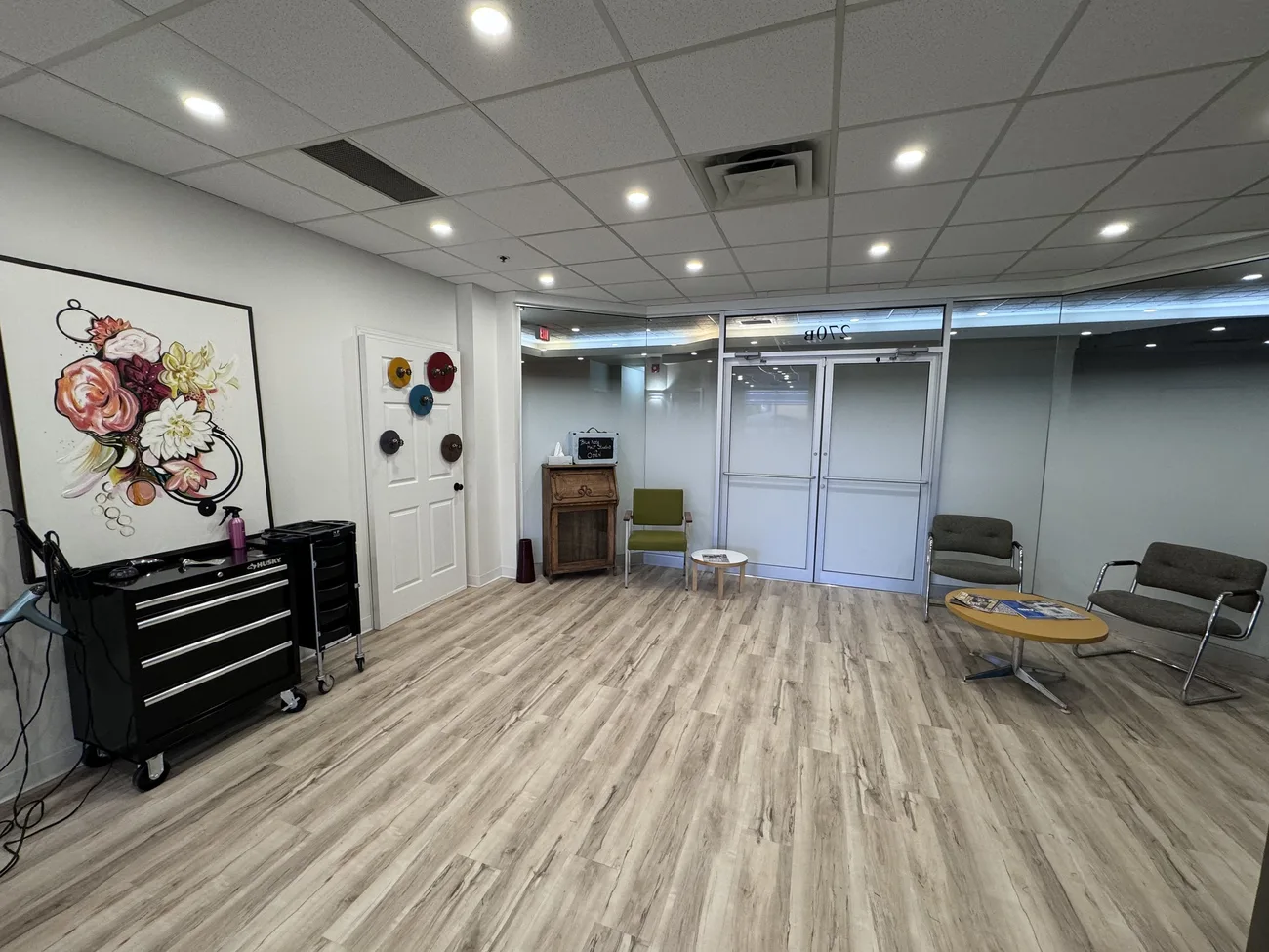 The open studio floor with floral wall art