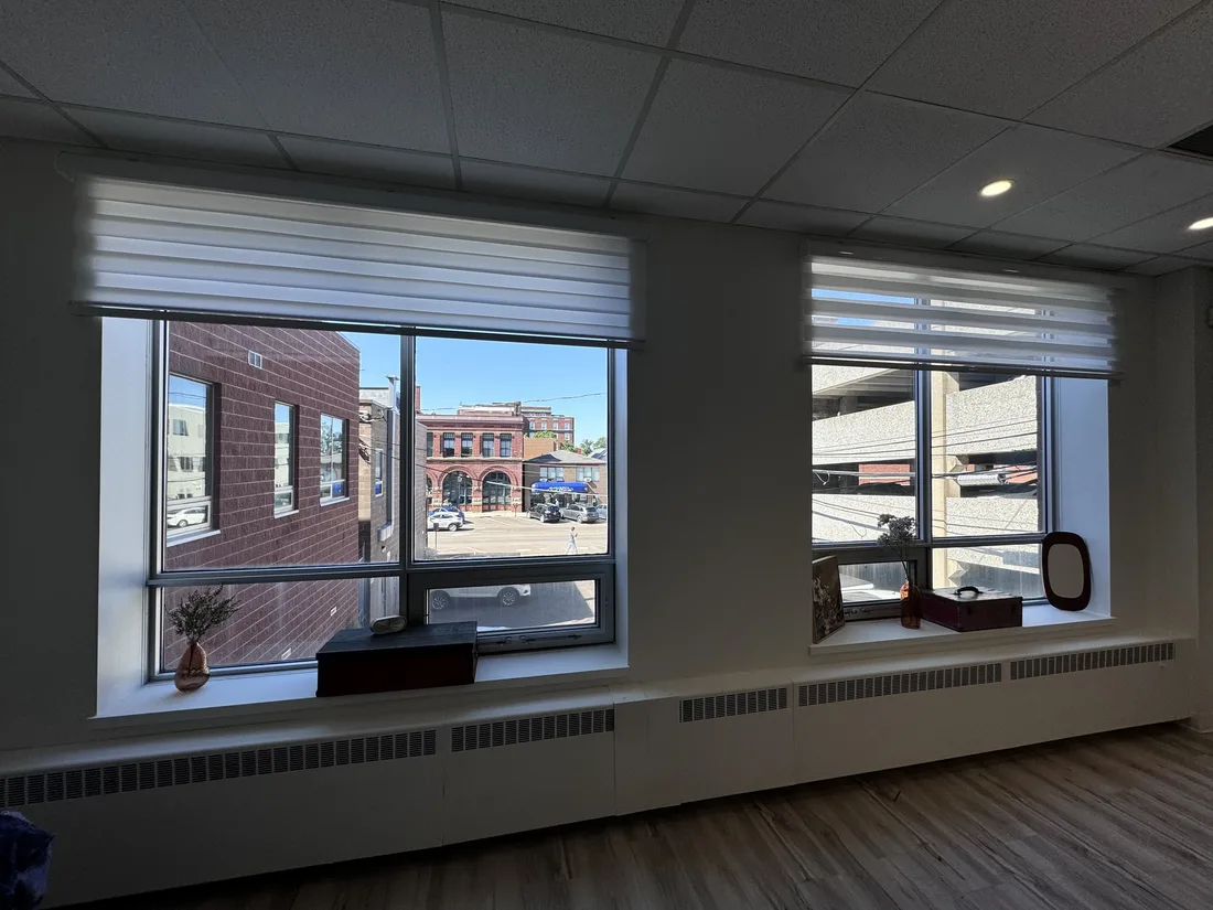 Big windows over Kent Street with flowers on the sill